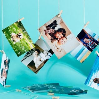 lustre photo prints hanging from a string display