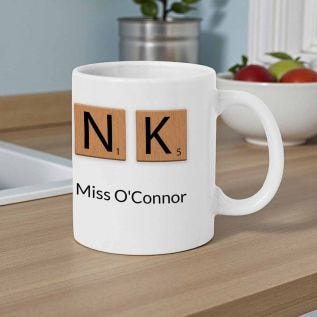 holding a personalised thank you teacher mug