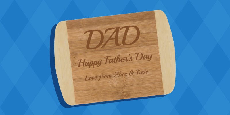 A whooden, engraved chopping board. Engraved with 'Dad, Happy Father's Day. Love from Alice & Kate. Personalised Father’s Day gift from Max Spielmann